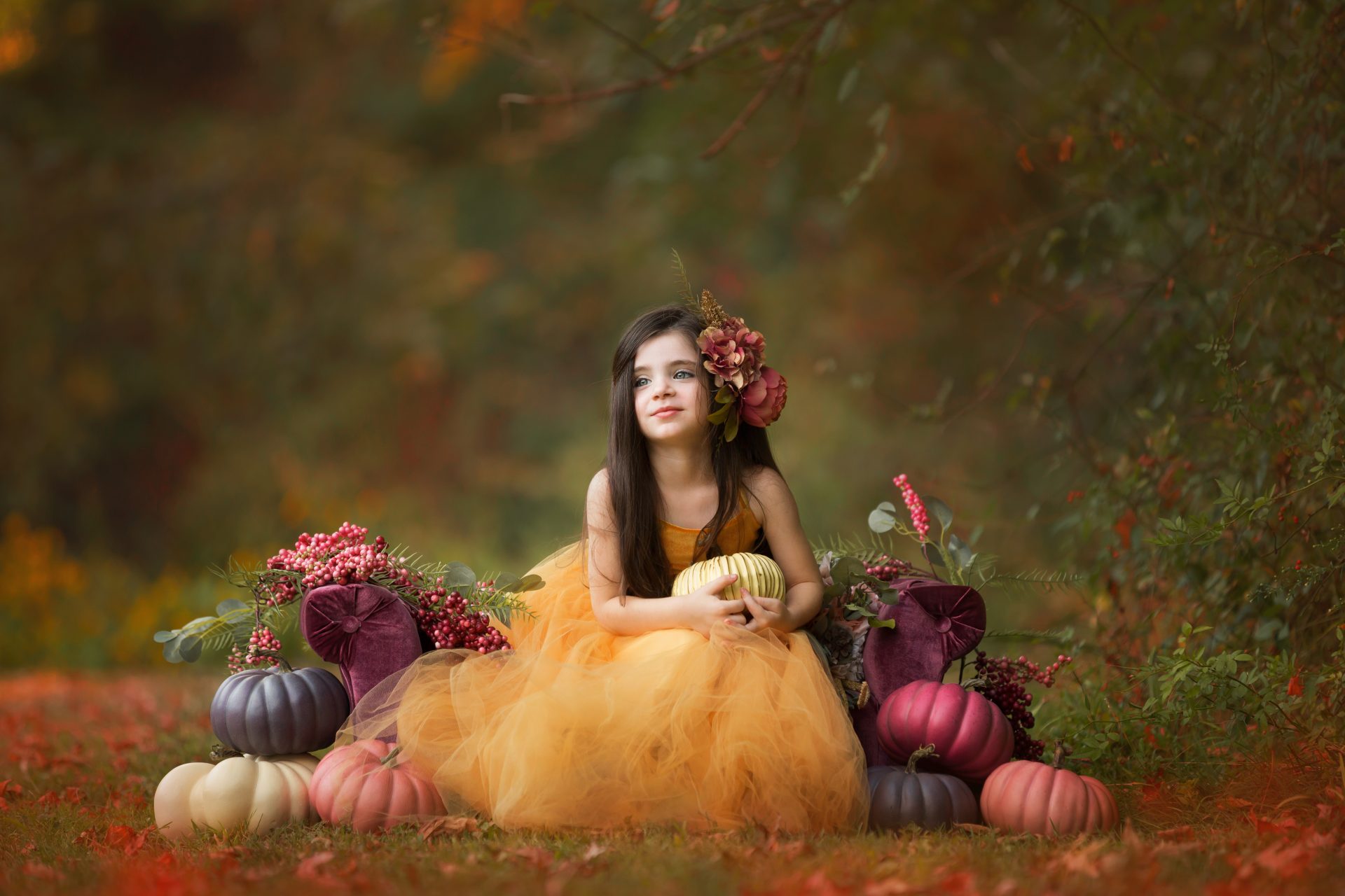 little girl poses in a gold dress in scenic fall new jersey after a portrait session with a new jersey childrens' photographer
