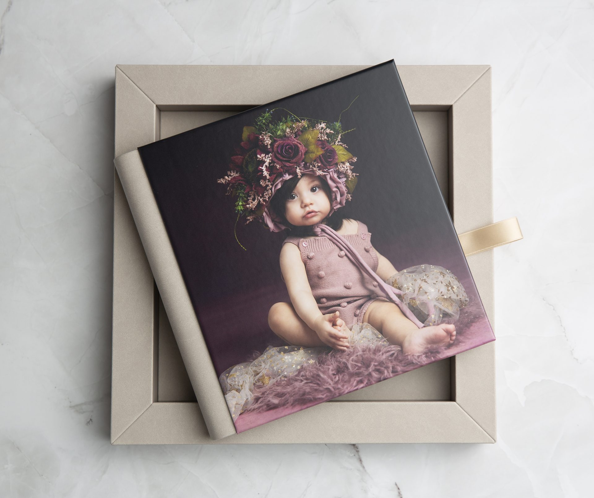 custom album from nj childrens photographer sofia ribeiro photography featuring a toddler in a floral headress