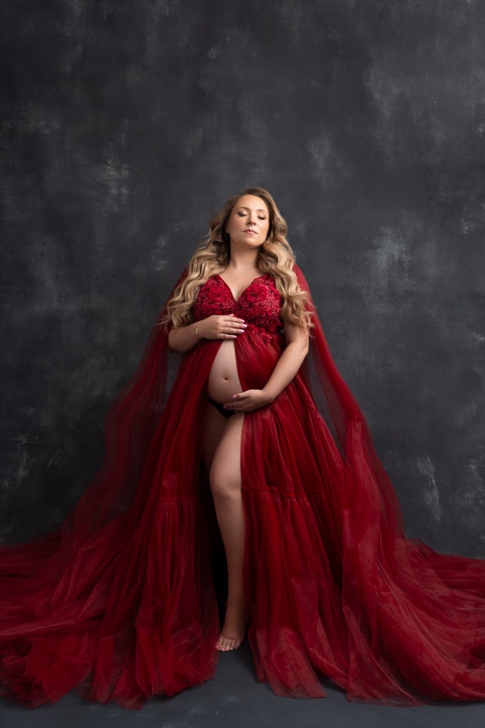 mom  in red maternity gown