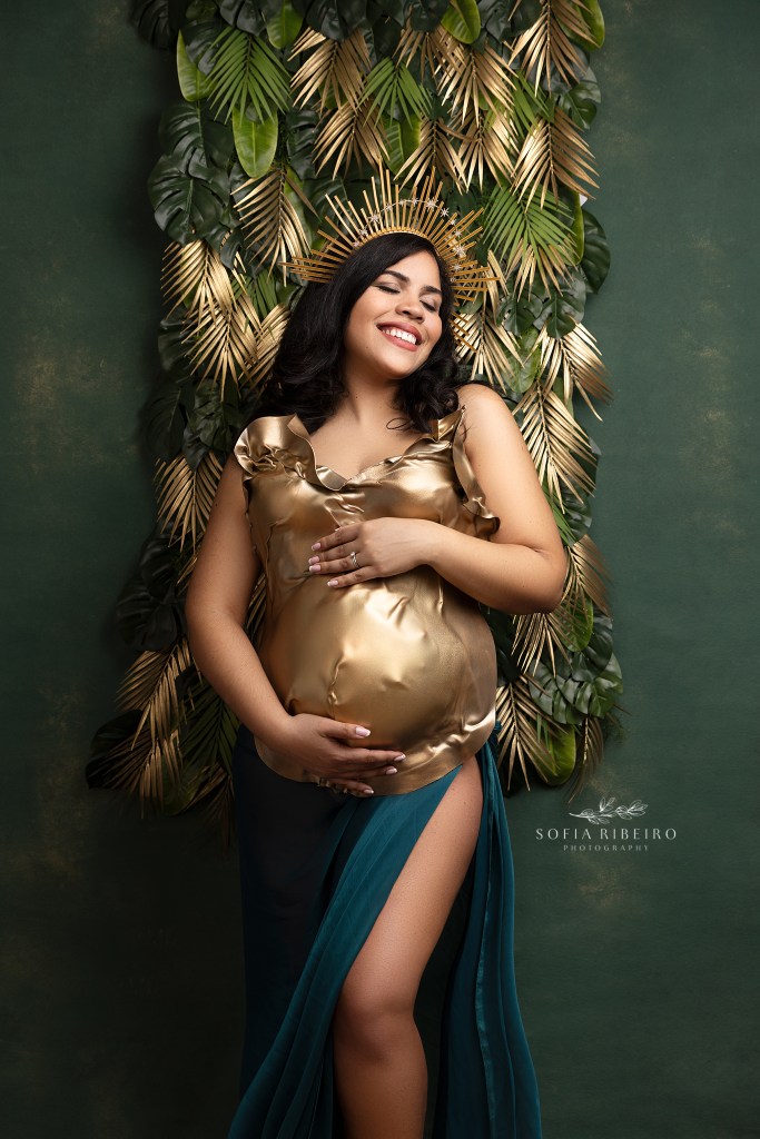 mom poses in a stylized maternity shoot with the colors of brazil for a session with a west new york maternity photographer