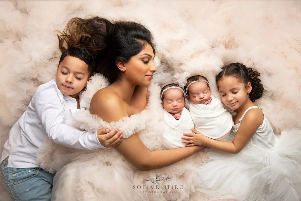 posed family newborn session with mom babies and siblings in somerset new jersey