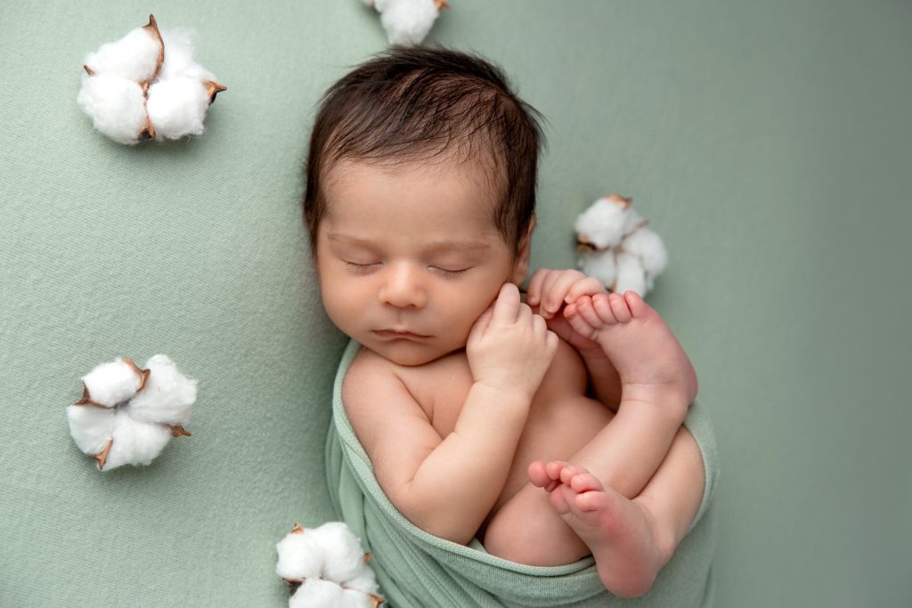 simple newborn posing with baby in wrap, in how to choose a newborn photographer, union new jersey