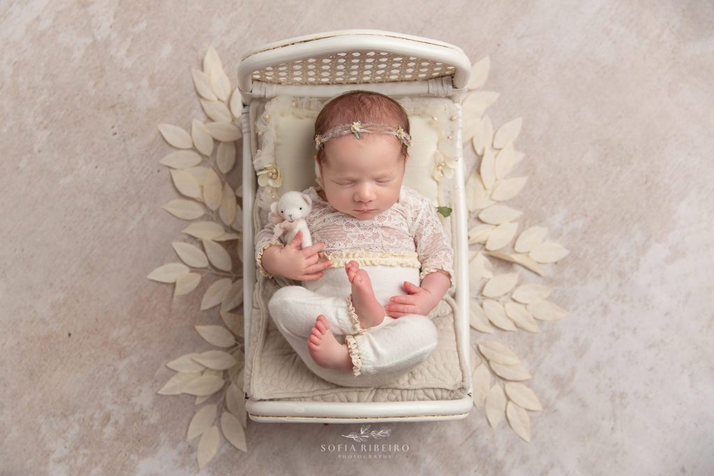 choosing a westfield new jersey newborn photographer featuring a baby in a newborn prop