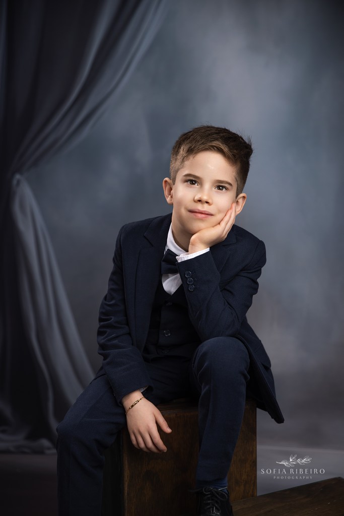 first holy communion photography in new jersey with a boys portrait in a navy suit