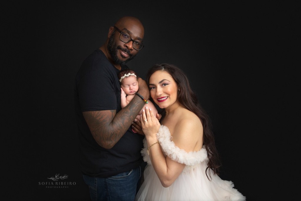 newborn poses with parents