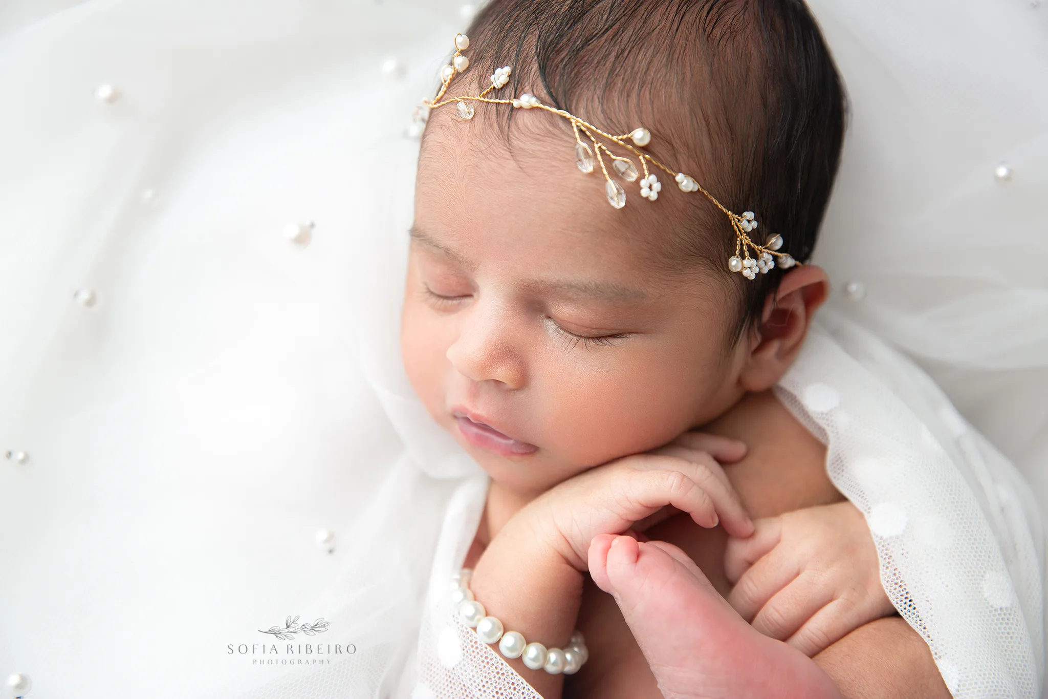 a nj newborn photographer expertly poses babies in cute wraps and delicate accessories for photos