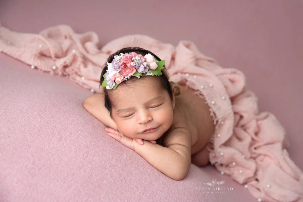 montclair nj newborn photographer, baby girl in pink smiling