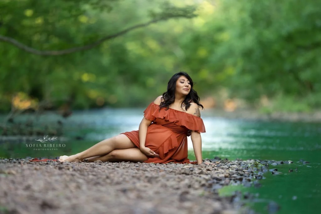 river maternity session nj, mom in orange gown in water