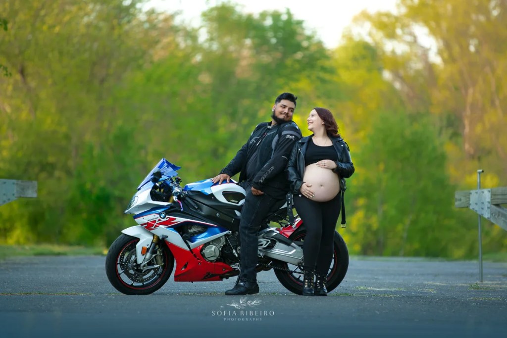 motorcycle maternity session outdoors with red and blue motorcycle