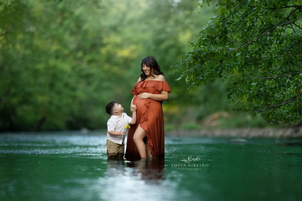 river maternity session nj, mom in orange gown in water