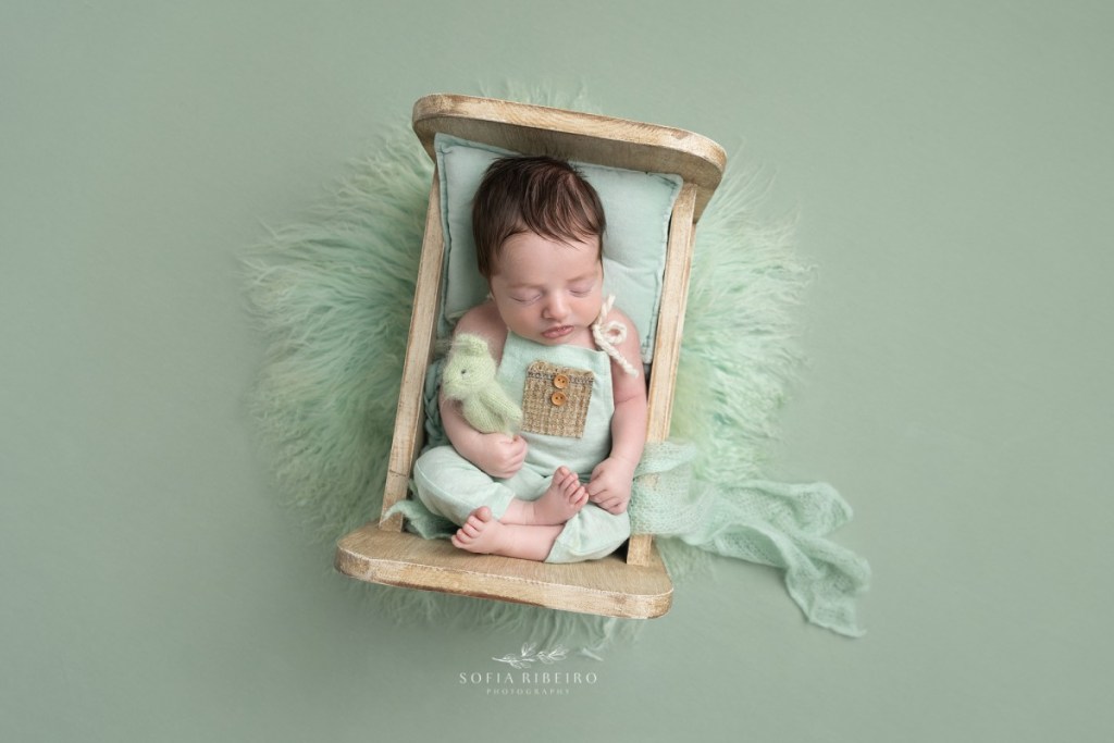 baby boy in mint green in bed with linden nj newborn photographer