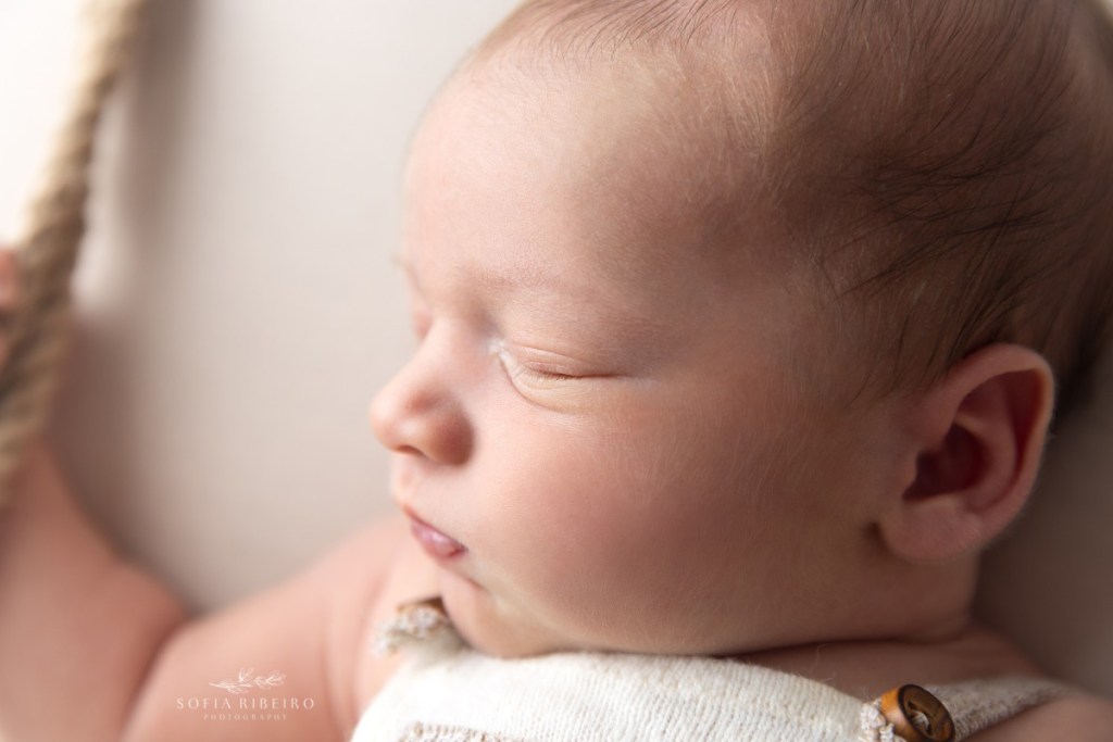 nj newborn photographer takes a closeup of sweet baby cheeks during his newborn portraits