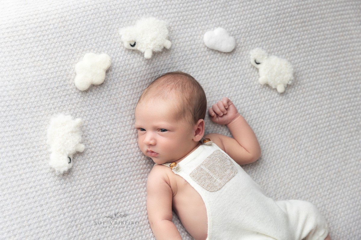 north bergen nj newborn photographer, baby lying awake, couting sheep above his head