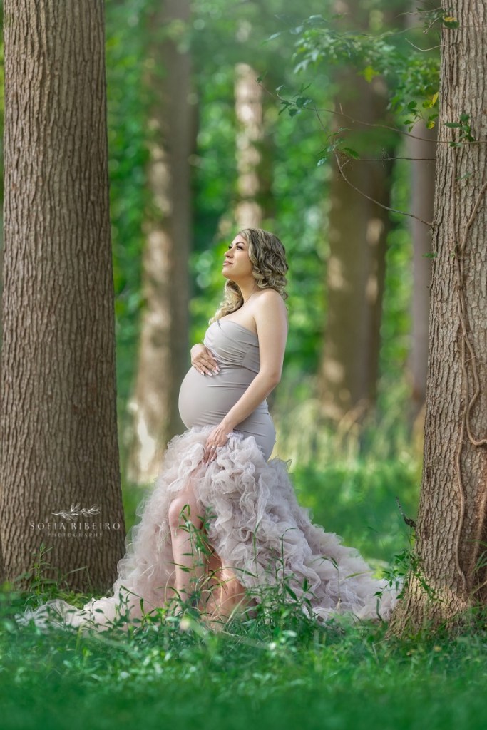 outdoor maternity photography nj, staring up into the sun in a taupe ruffle gown