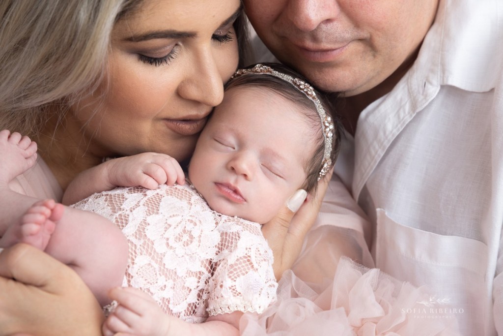 kearny nj newborn photographer closeup of baby in parents arms