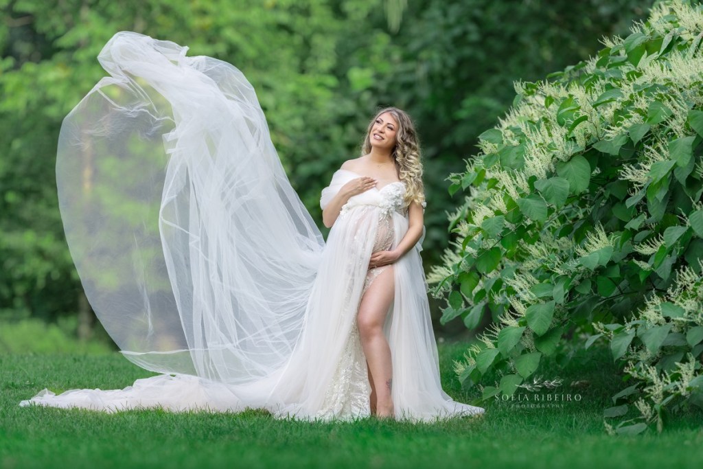 outdoor maternity photography nj, mom in a white gown being tossed in the air