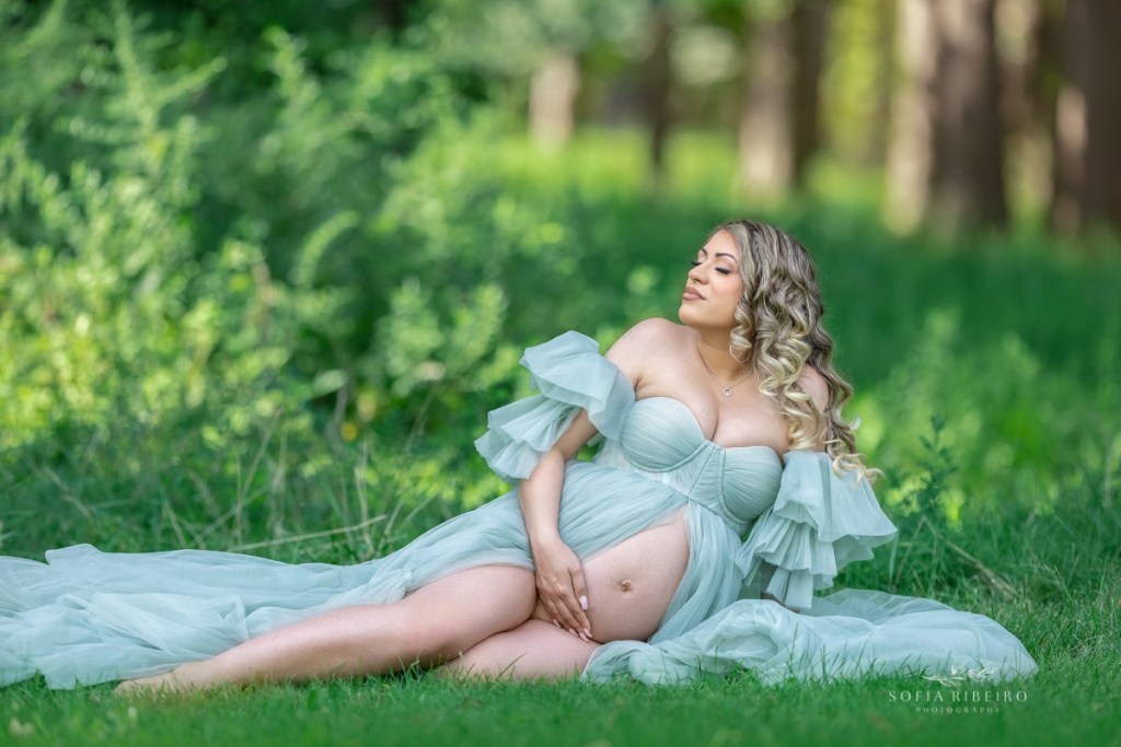 outdoor maternity photography nj, mom in a sage dress sitting on the ground