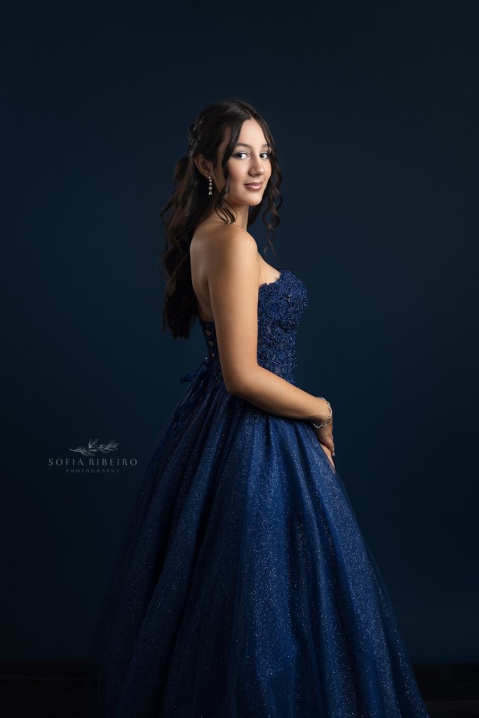 teen celebrates her sweet sixteen in a navy blue gown after taking portraits with a new jersey childrens photographer