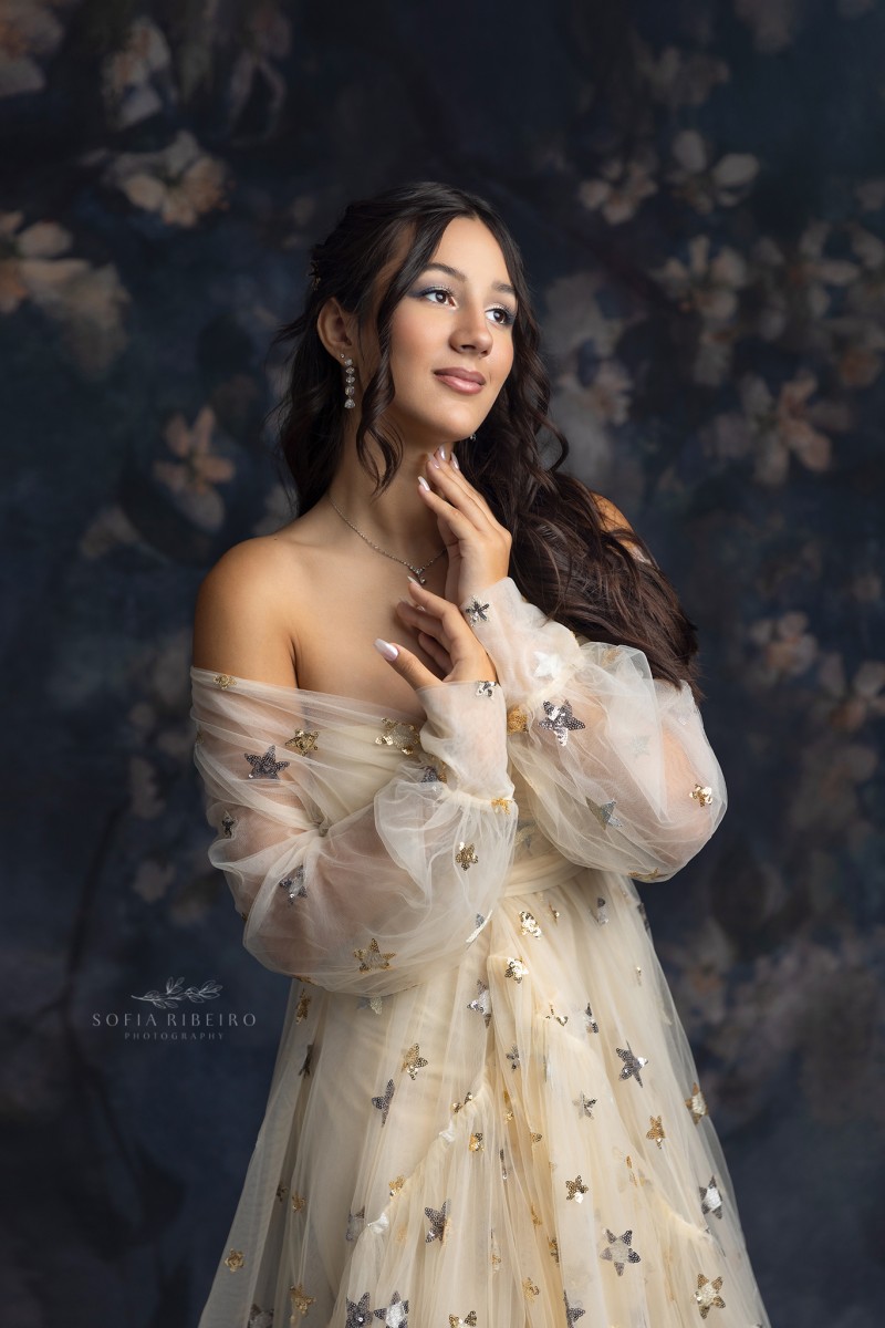 teen poses in a starry tulle dress during a sweet sixteen session with a nj children's photographer