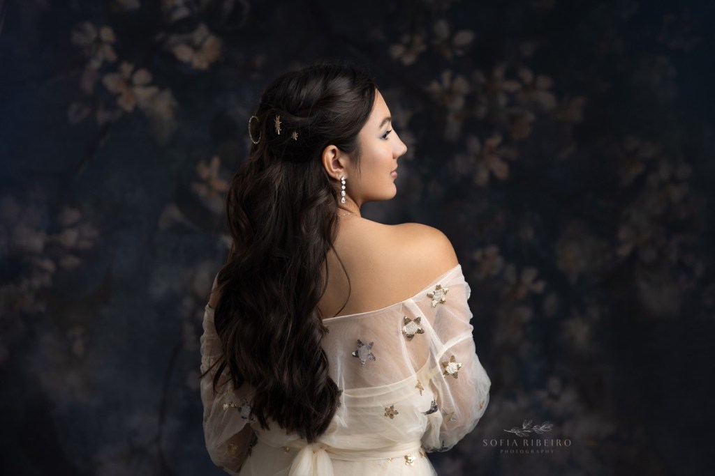 teen poses in a starry tulle dress during a sweet sixteen session with a nj children's photographer