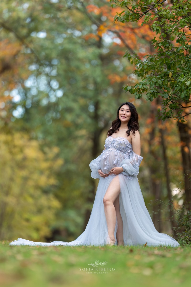maternity session with mom in a blue dress in a local park in new jersey in the fall