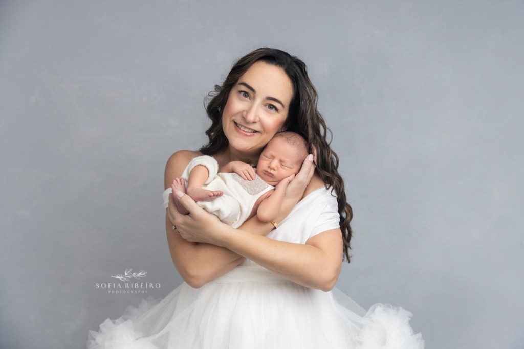 grey newborn session, baby with mom smiling