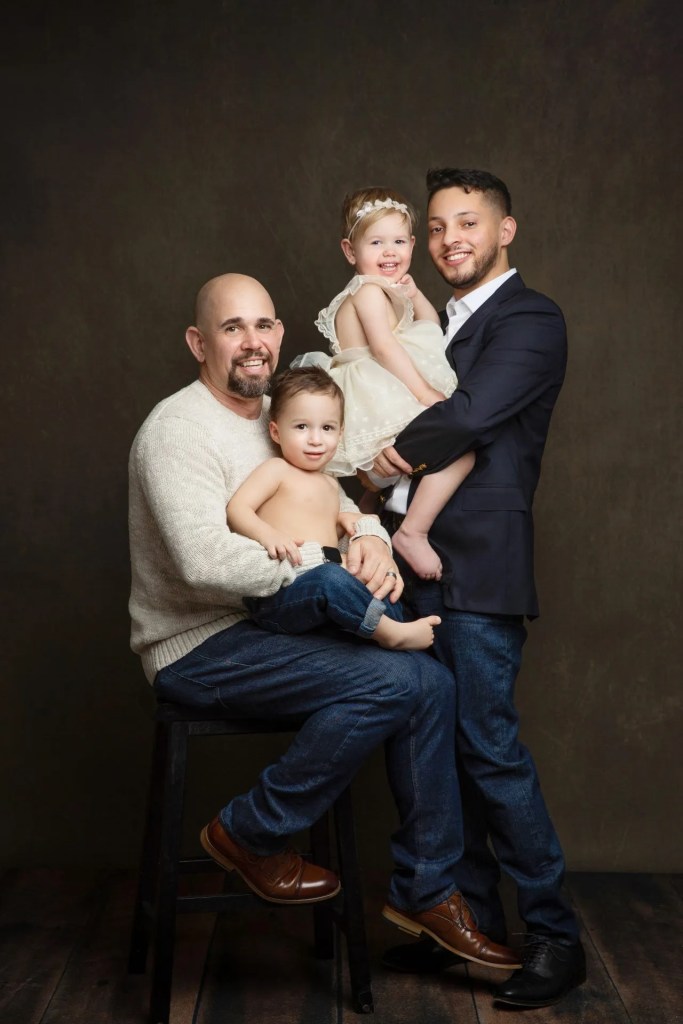 nj family photographer dads with babies brown backdrop, dressy