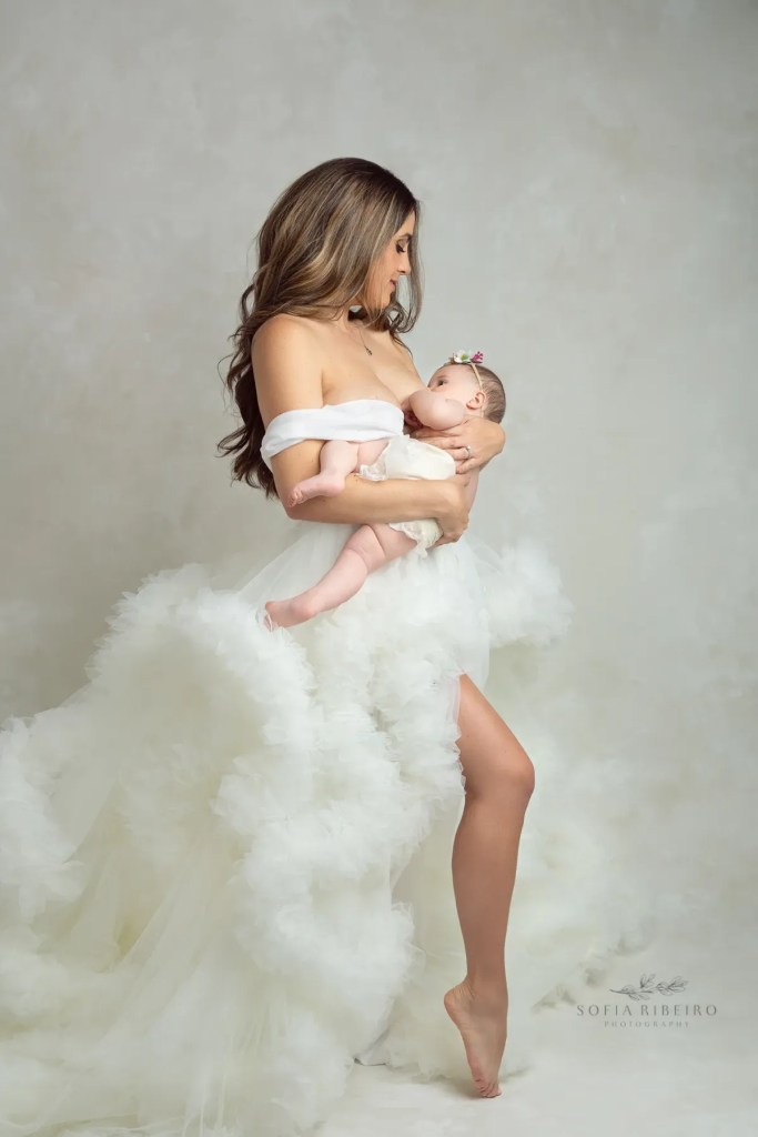 a mom and baby take photos together for mother's day