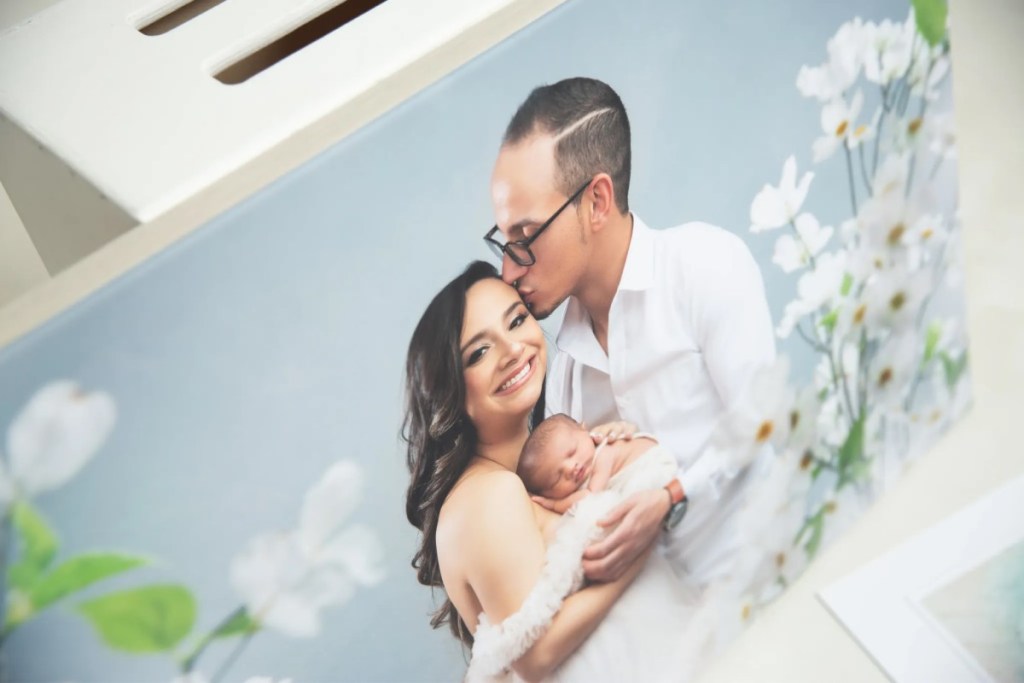 newborn photography in nj featuring italian canvas of mom and dad holding baby together
