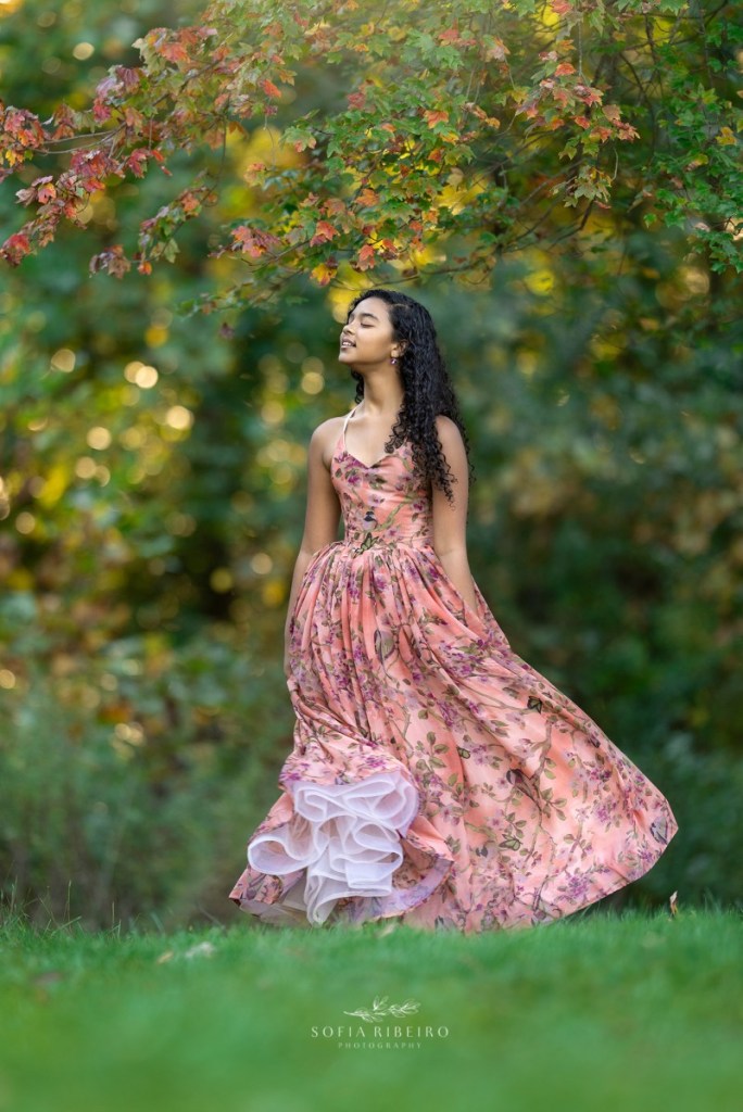 family photo session at watchung reservation, nj, daughter with leaves and gown