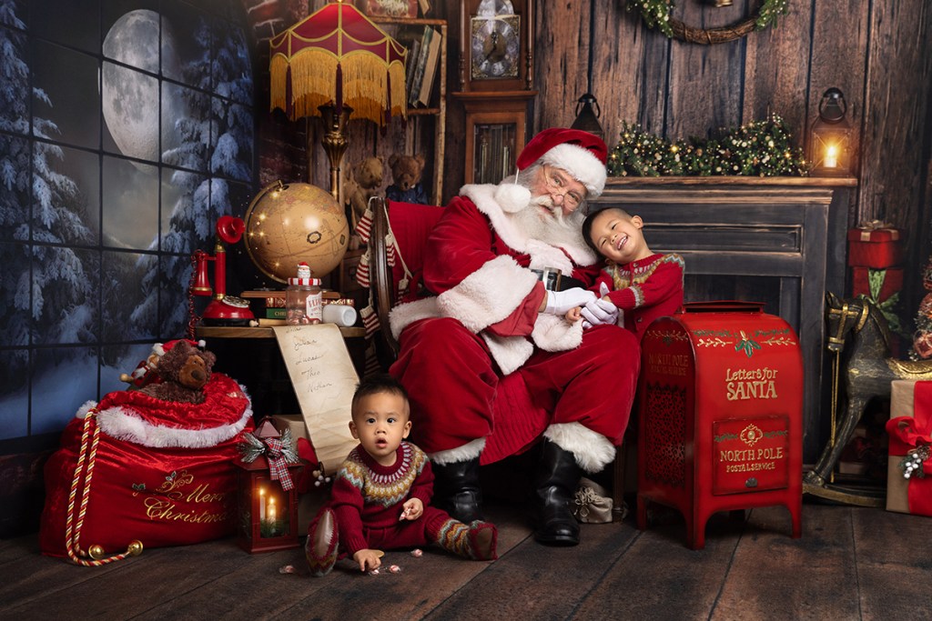 two little boys visit santa while doing christmas events for kids in nj