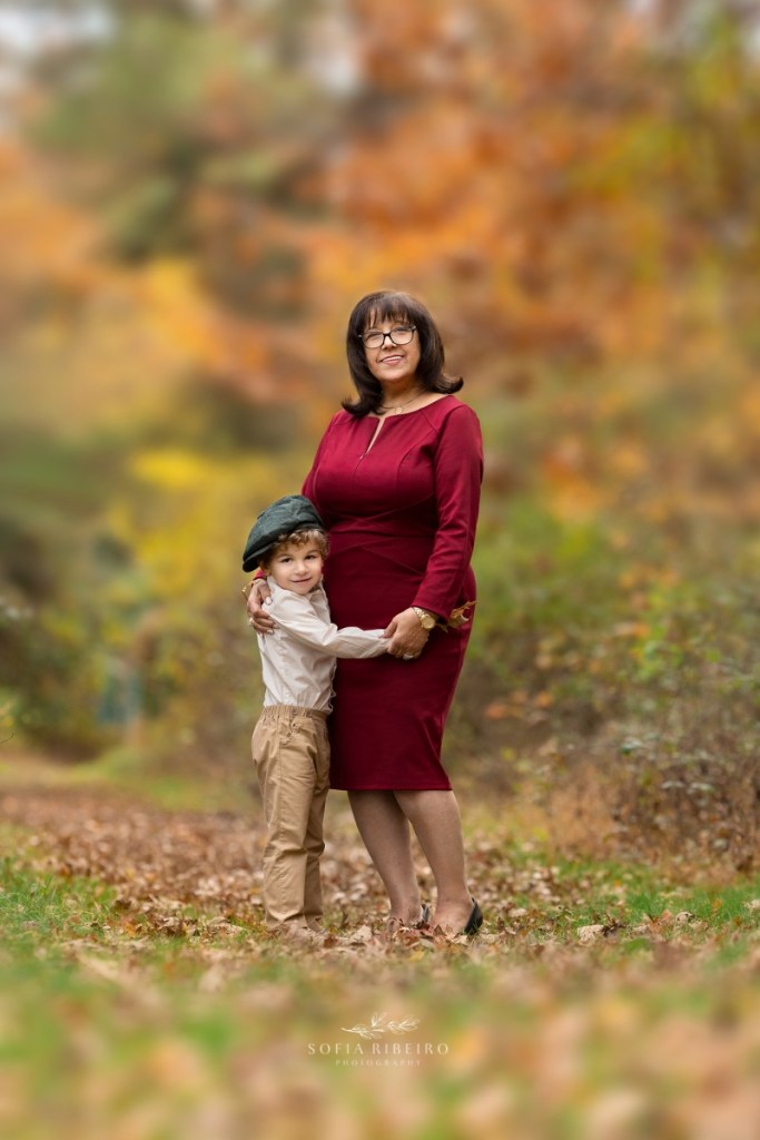 grandmother poses with grandson during a family session