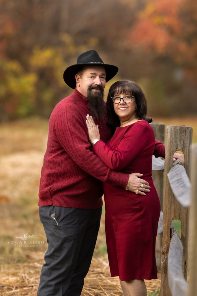 grandparents pose together before a grandparent and grandchildren session