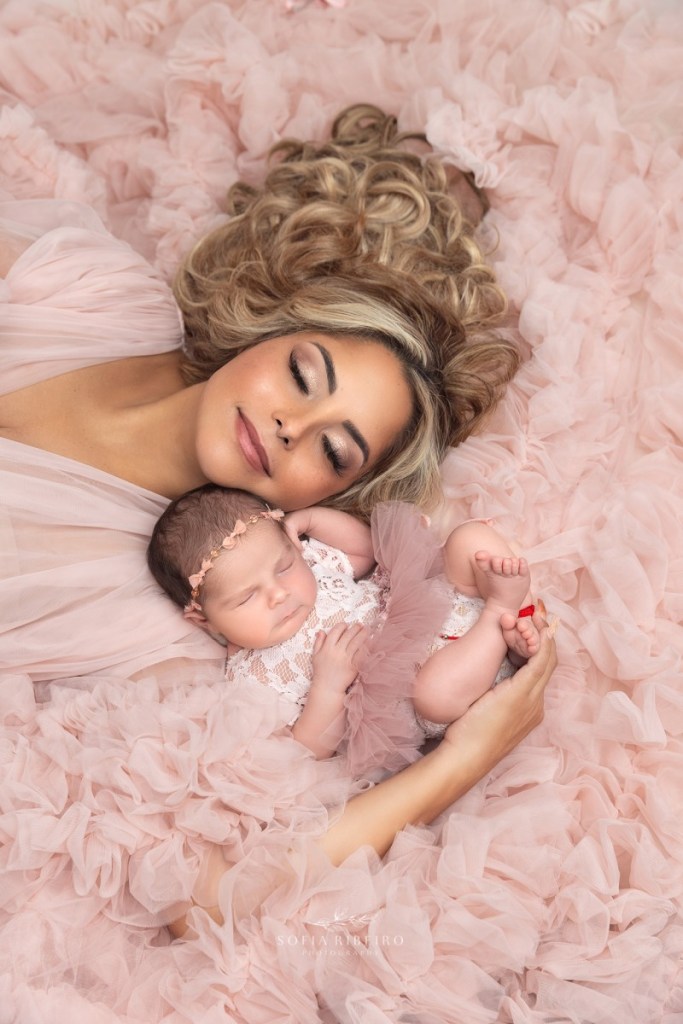 mom and baby snuggle together during a nj newborn photography session