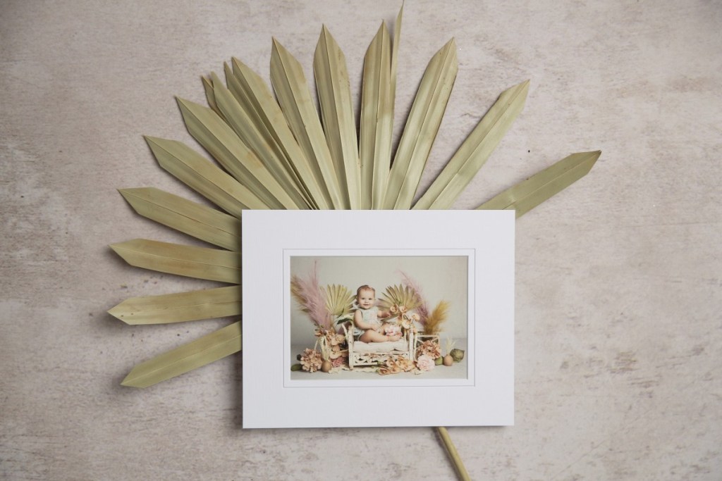 a little girl sits in a bed in fine art print taken from a portrait session with a nj childrens photographer