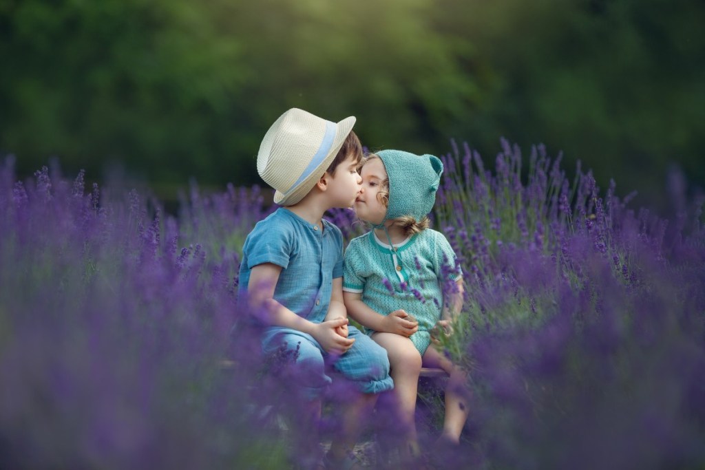 two brothers share a smooch in a field of lavender in nj after taking photos with an nj childrens phtoographer