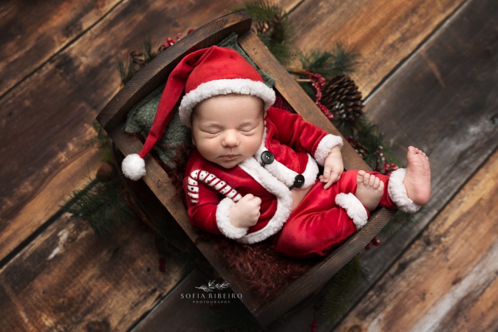christmas themed newborn photos with baby santa suit