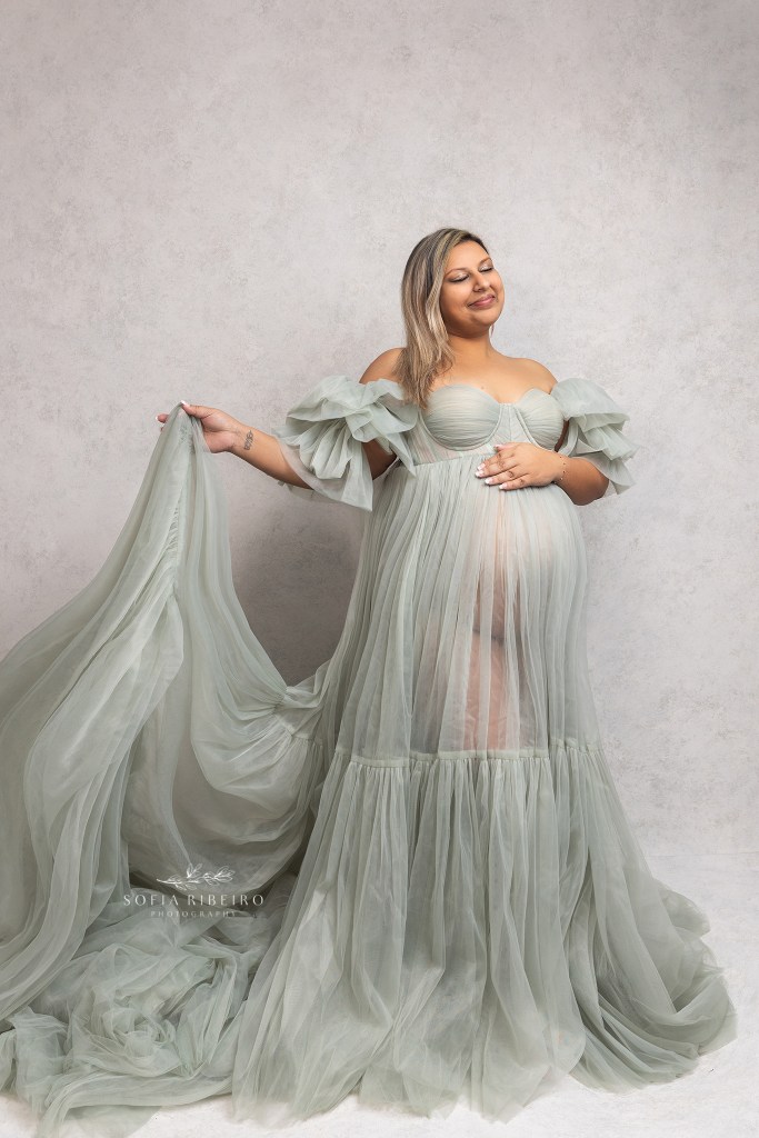 mom poses solo in a mint green ruffled gown during her maternity session in roselle park nj