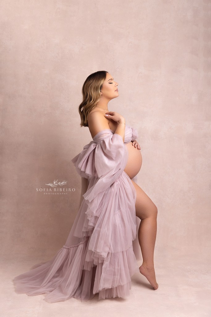 a profile image of an expectant mother in a garwood nj maternity photography studio, featuring a gorgeous pink tulle layered dress