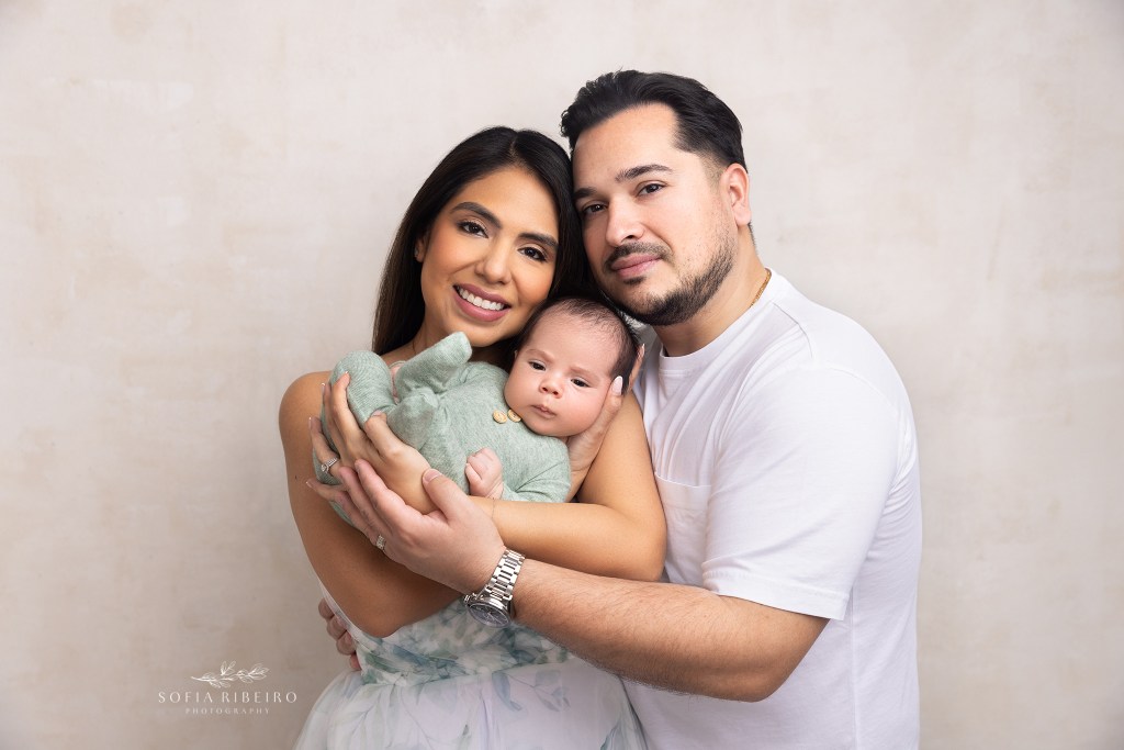 a new portrait of mom and dad together with their newest baby