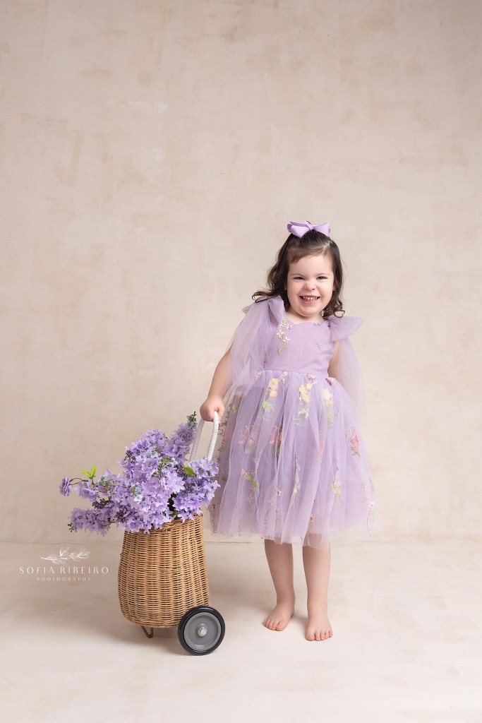 big sister giggles during a photo session in westfield nj