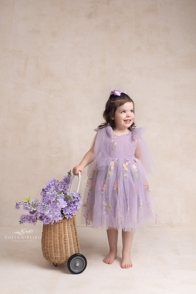 big sister giggles during a photo session in westfield nj