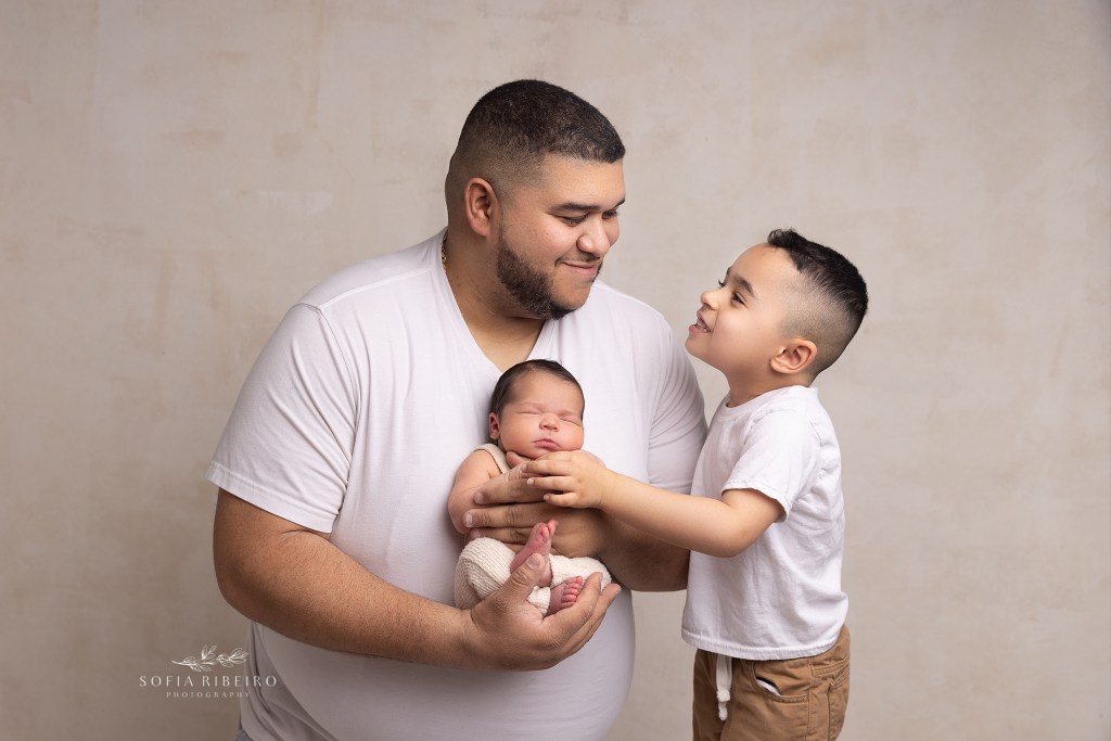 dad smiles with pride at his two baby boys in wharton nj