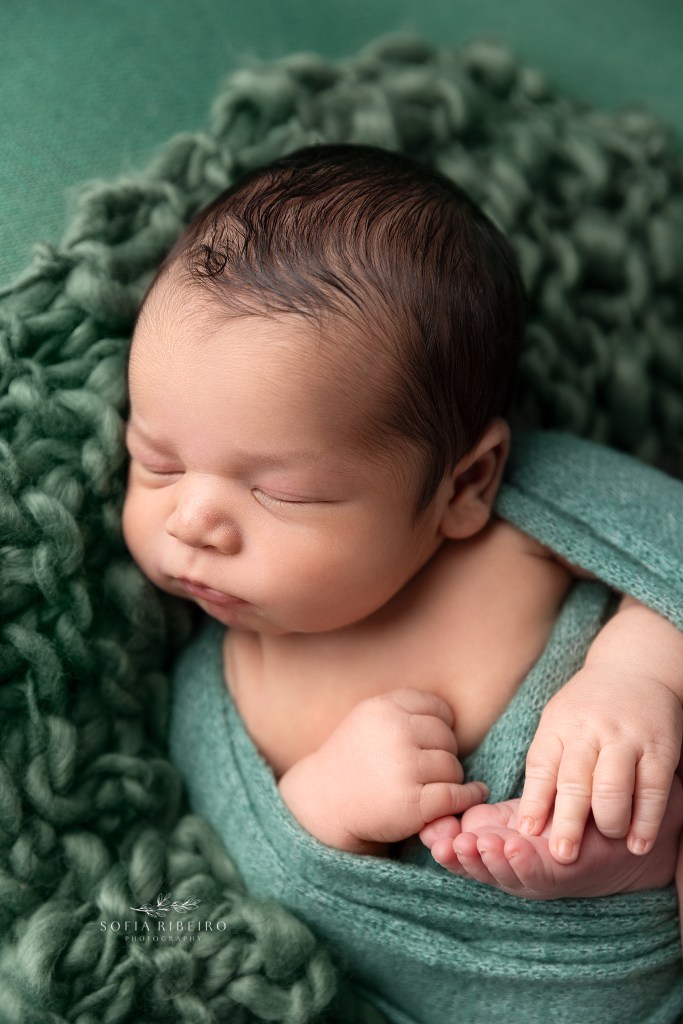 baby is wrapped in gorgeous greens and sleeps softly during a session with wharton nj newborn photographer