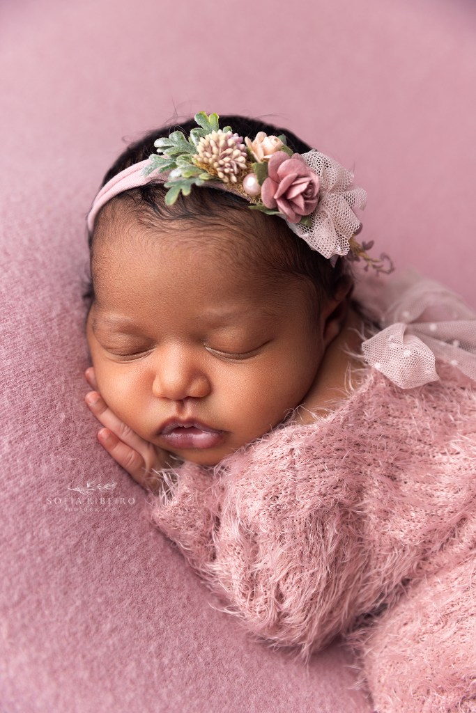 a photo closeup of a newborn baby girls face