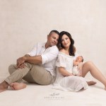 a red bank nj newborn photographer captures mom and dad beaming over their new son