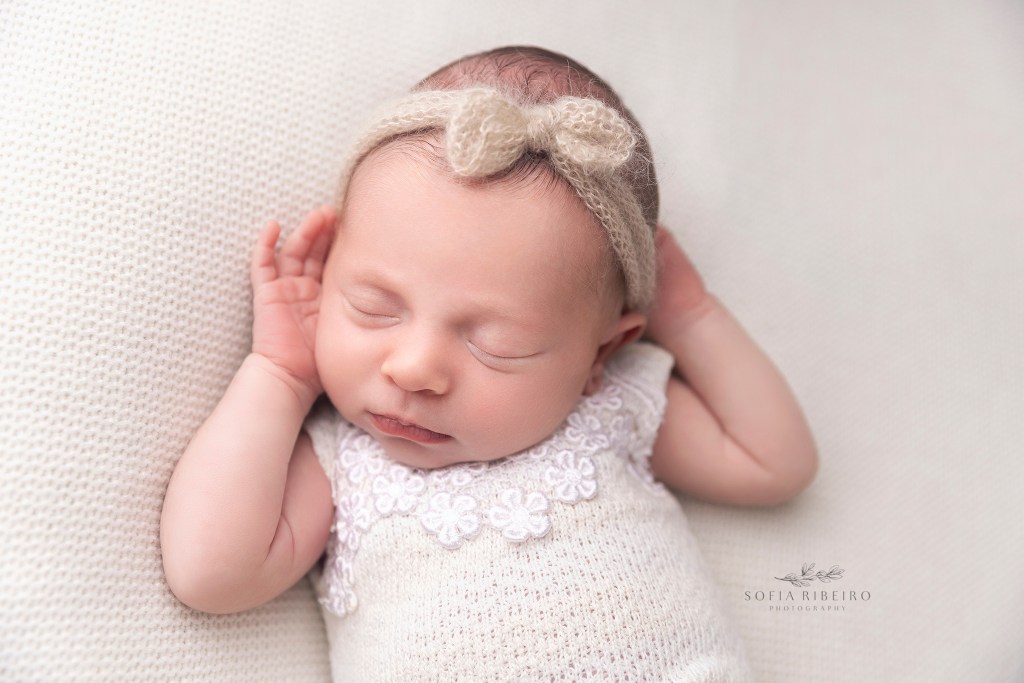 monroe nj newborn photographer captures baby in a relaxed sleeping pose, showing baby's natural beauty