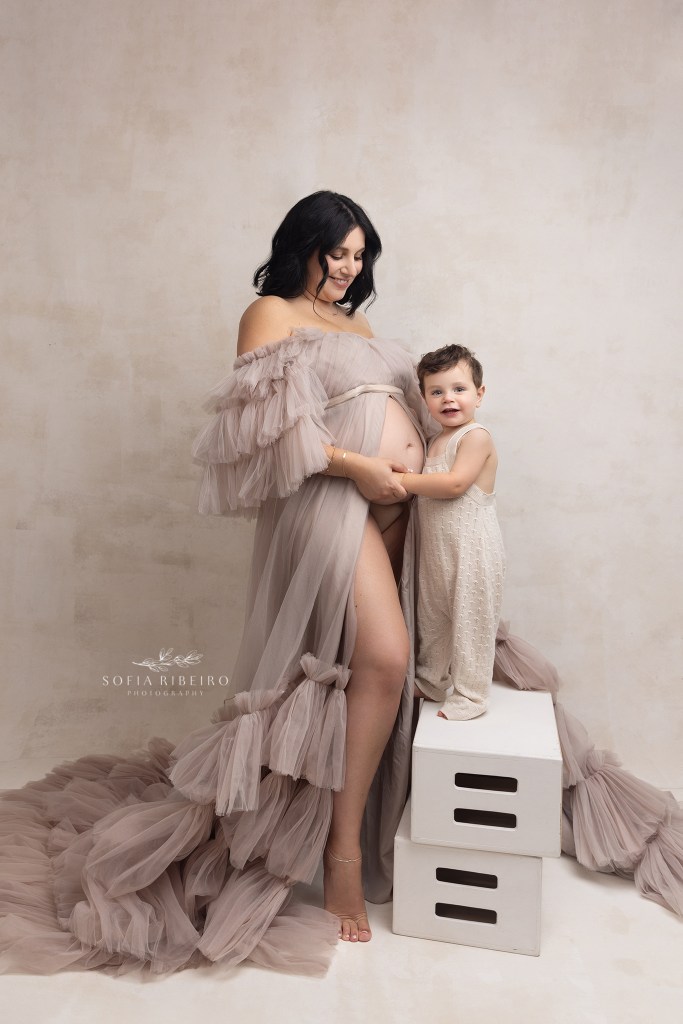 mom's little boy snuggles her belly during a maternity photo session in warren nj