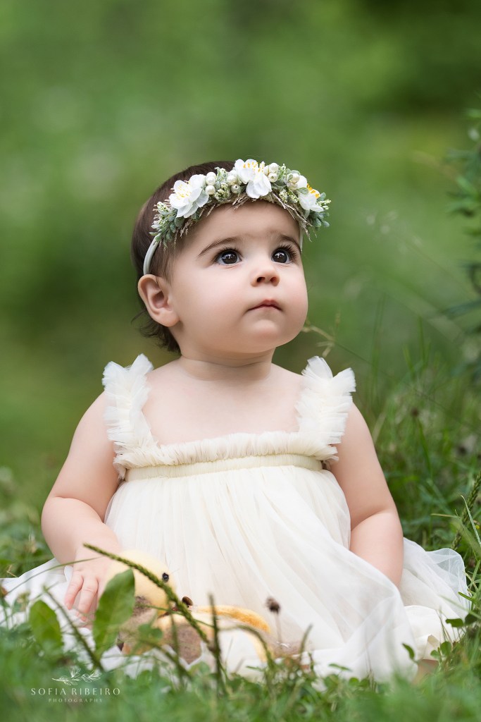 baby girl's soulful eyes gaze upwards for a solo portrait in nj