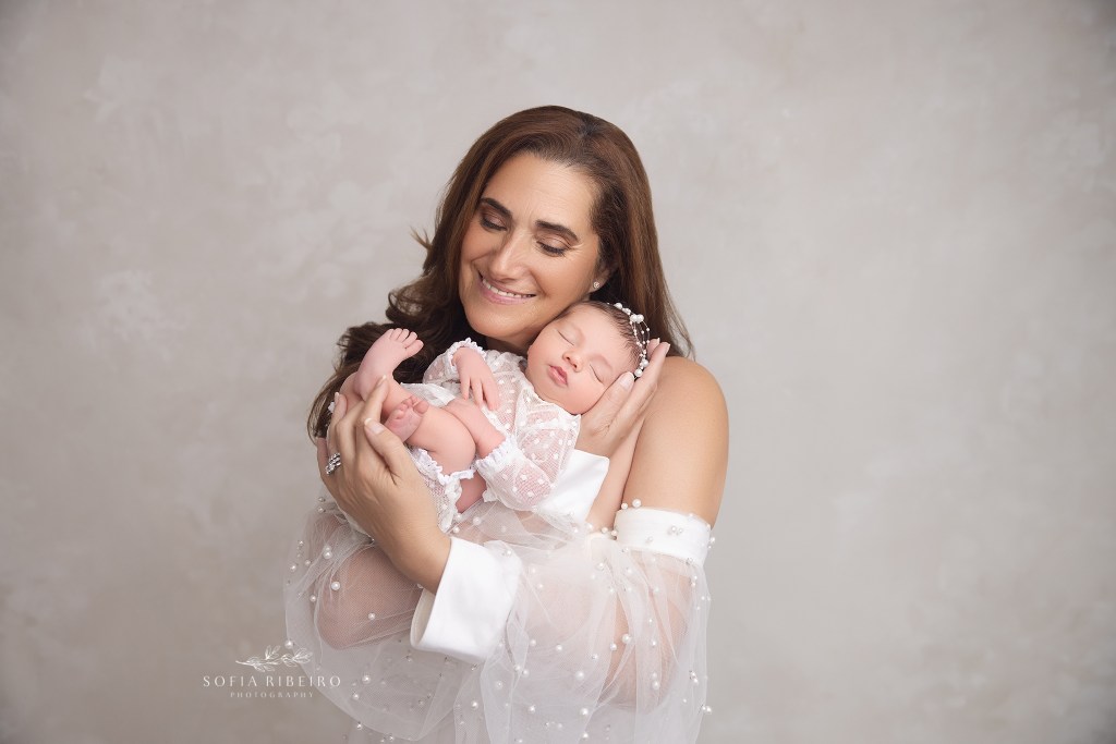 grandma cuddles her new baby granddaughter for posed newborn photos in belleville nj
